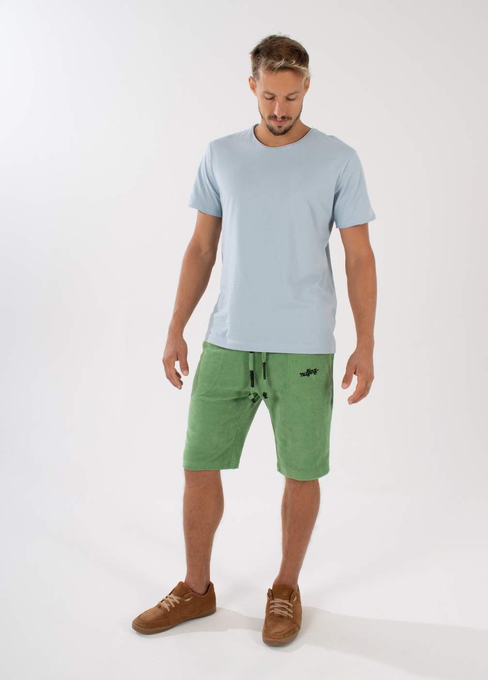 nuffinz STONE GREEN TOWEL SHORTS - whole outfit visible from the front - made out of organic terry cloth - sustainable men's shorts - green unicolor